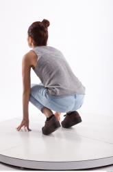 Kneeling photo references of Molly blue jeans womna singlet